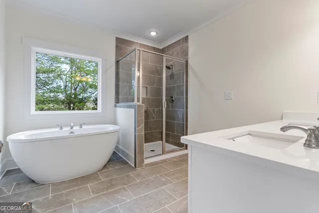 a view of a house with snow on the road