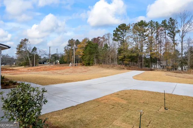 a view of an empty room and wooden floor