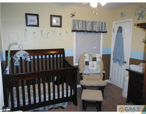 61 Glenville Road Edison, NJ 08817 - Photo 3 of 10 a bedroom with furniture and wooden floor
