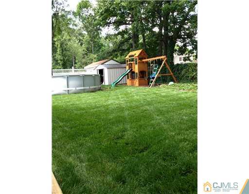 61 Glenville Road Edison, NJ 08817 - Photo 9 of 10 a view of a small yard in front of a house