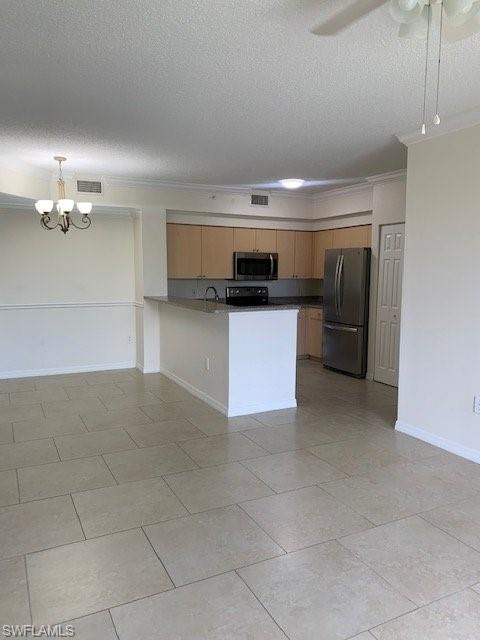 1180 Reserve Way, Unit 206 Naples, FL 34105 - Photo 4 of 18 a kitchen with a sink and cabinets