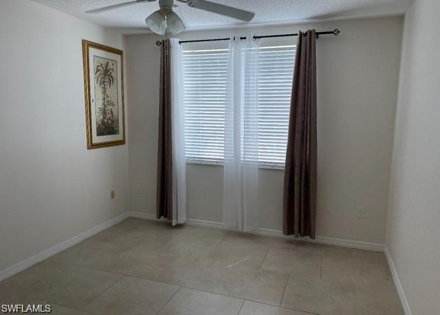 1180 Reserve Way, Unit 206 Naples, FL 34105 - Photo 6 of 18 an empty room that has a window in it