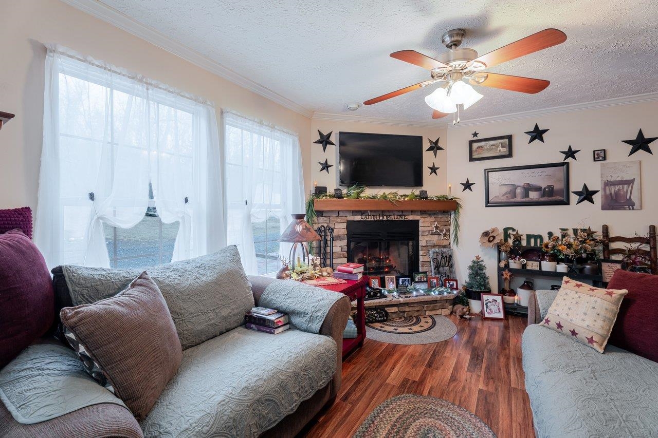 523 Gravels Road Harrisonburg, VA 22802 - Photo 18 of 65 a living room with furniture fireplace and flat screen tv