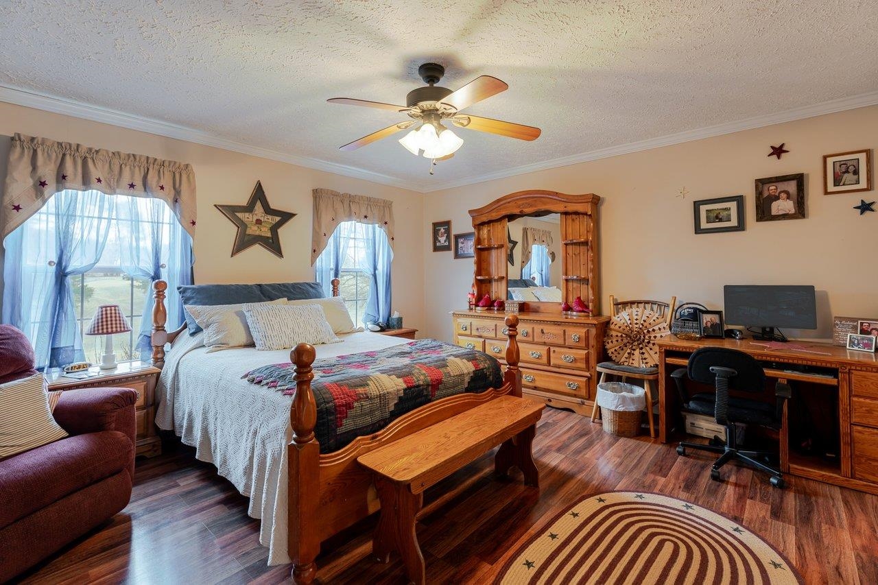 523 Gravels Road Harrisonburg, VA 22802 - Photo 21 of 65 a bedroom with a bed gym equipment and a chandelier