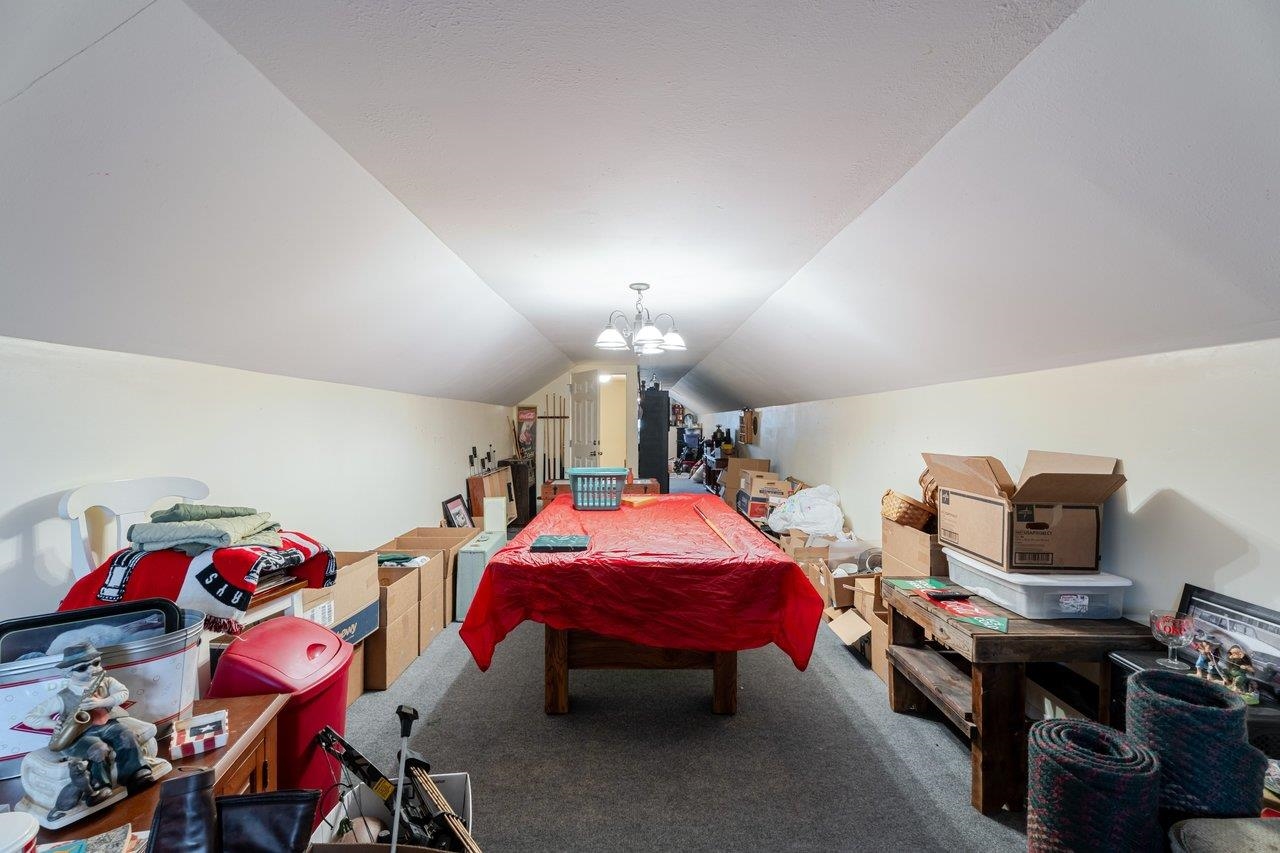 523 Gravels Road Harrisonburg, VA 22802 - Photo 36 of 65 a bedroom with furniture and a chandelier