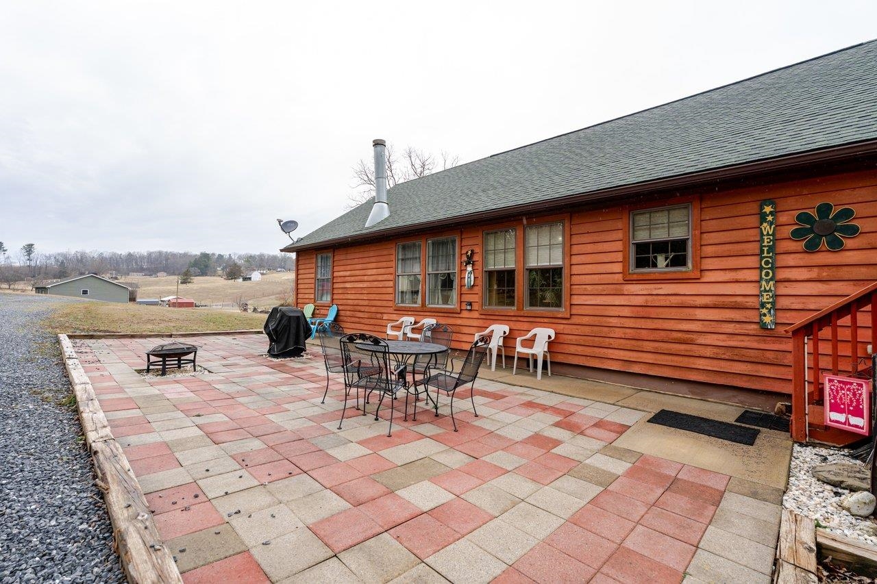 523 Gravels Road Harrisonburg, VA 22802 - Photo 43 of 65 a backyard of a house with dining table and chairs