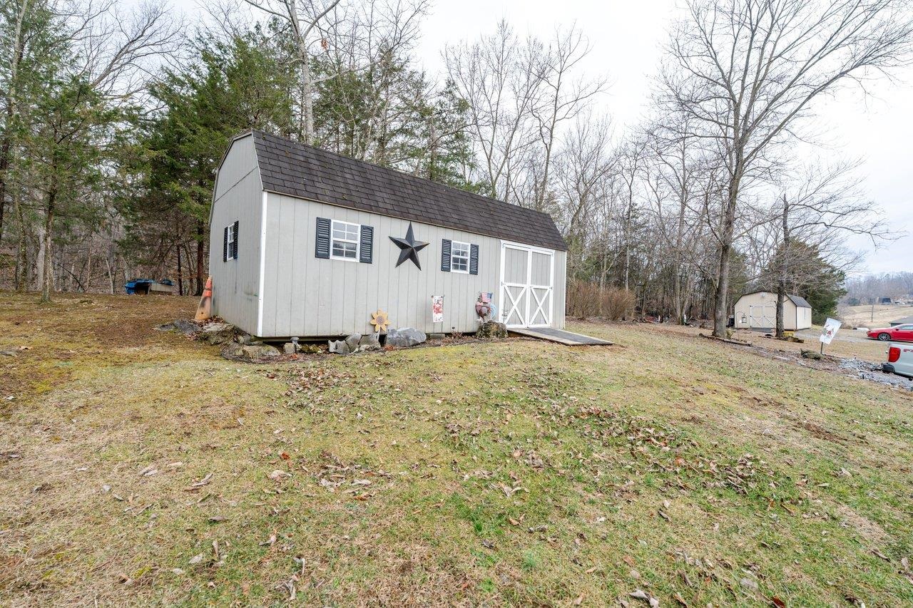 523 Gravels Road Harrisonburg, VA 22802 - Photo 55 of 65 a white house that has a tree in front of it