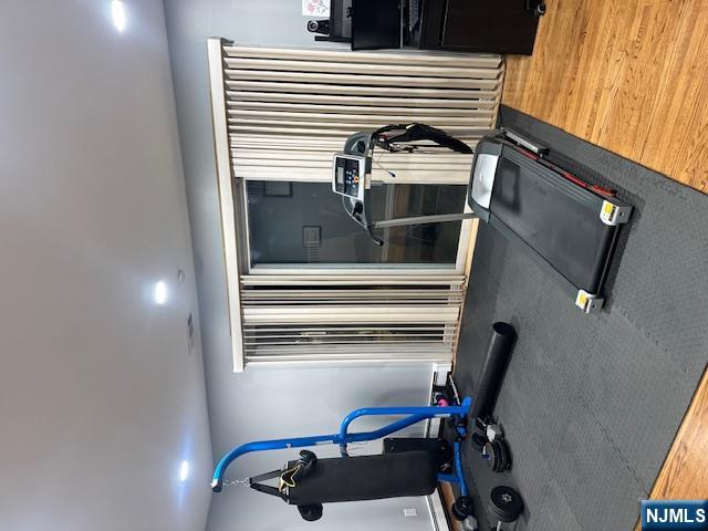 26 James Terrace Pompton Lakes, NJ 07442 - Photo 13 of 43 a room with gym equipment and a large mirror