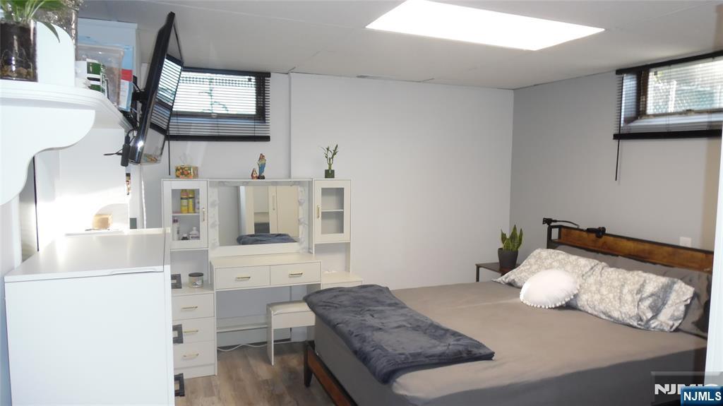 26 James Terrace Pompton Lakes, NJ 07442 - Photo 17 of 43 a bedroom with a bed and a flat screen tv
