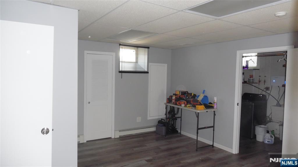 26 James Terrace Pompton Lakes, NJ 07442 - Photo 25 of 43 a view of a hallway to a livingroom with wooden floor and a window