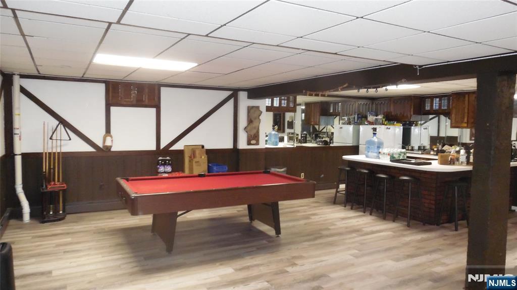 26 James Terrace Pompton Lakes, NJ 07442 - Photo 26 of 43 a room with table chairs and wooden floor