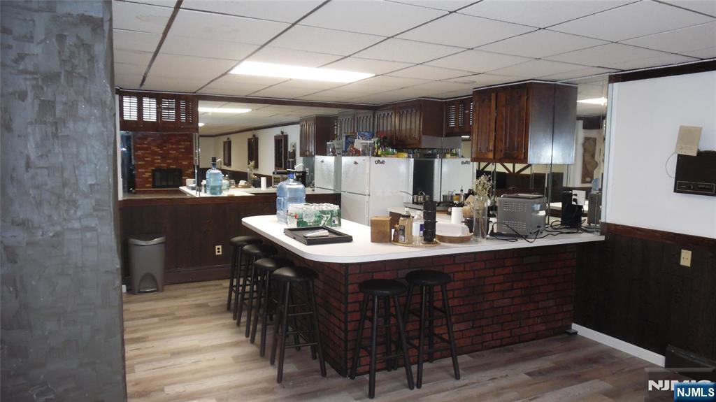 26 James Terrace Pompton Lakes, NJ 07442 - Photo 27 of 43 a kitchen with a sink cabinets and wooden floor