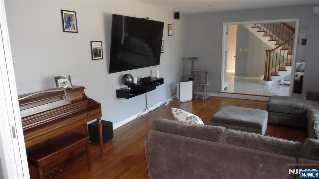 26 James Terrace Pompton Lakes, NJ 07442 - Photo 3 of 43 a living room with furniture and a flat screen tv