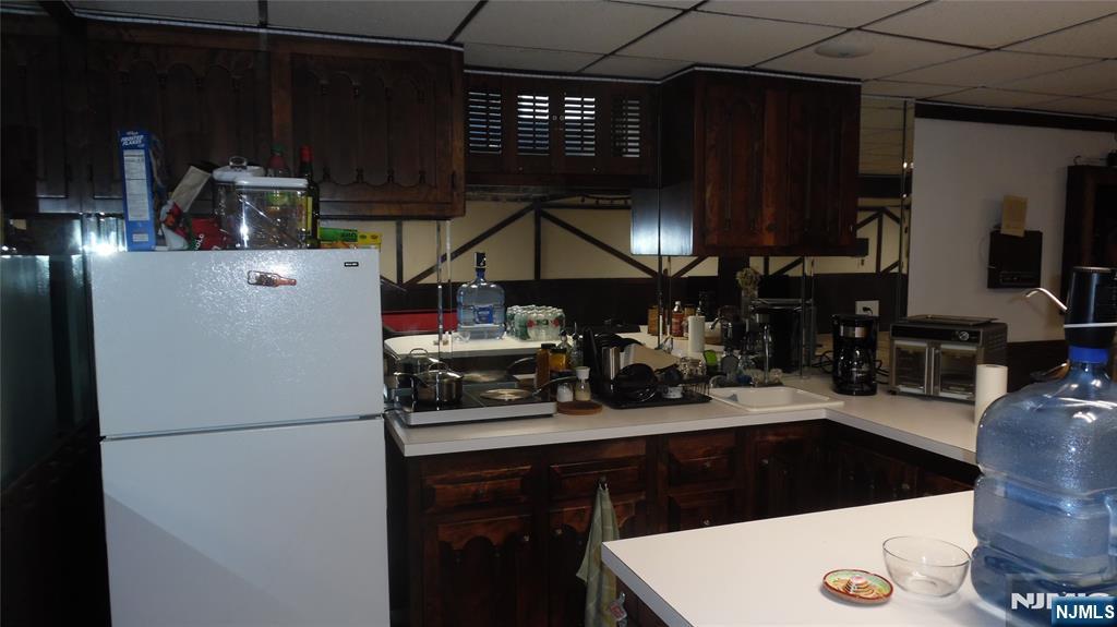 26 James Terrace Pompton Lakes, NJ 07442 - Photo 32 of 43 a kitchen with a sink and cabinets