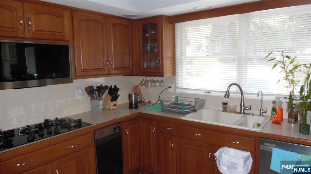 26 James Terrace Pompton Lakes, NJ 07442 - Photo 6 of 43 a kitchen with a sink and cabinets