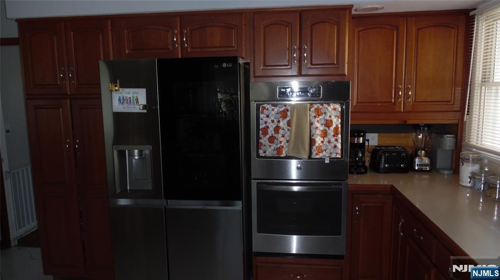 26 James Terrace Pompton Lakes, NJ 07442 - Photo 8 of 43 a kitchen with stainless steel appliances granite countertop a refrigerator and a stove