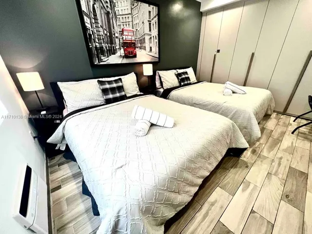 a bedroom with bed and window