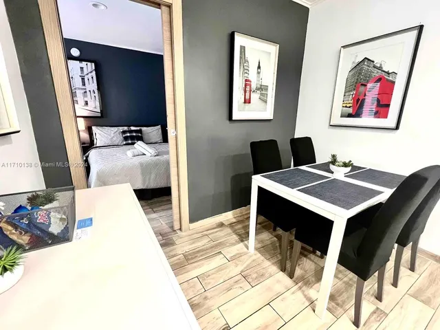 a bedroom with a bed and a table in it