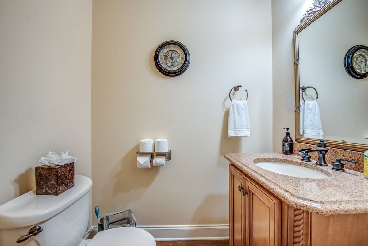 1215 Beaver Creek Road Mason, TN 38049 - Photo 38 of 74 a bathroom with a sink and a mirror