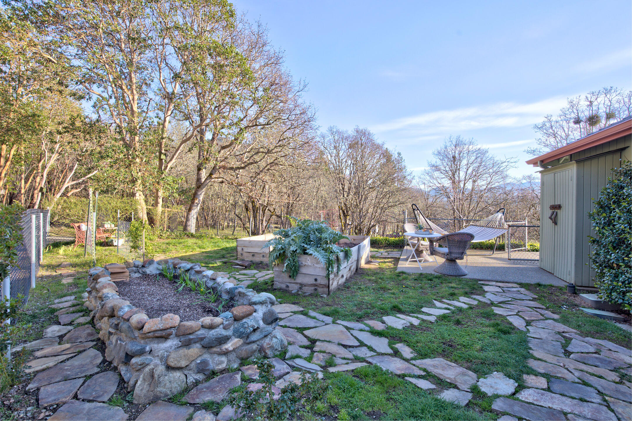 1440 Kubli Road Grants Pass, OR 97527 - Photo 36 of 56 a view of a house with backyard and sitting area