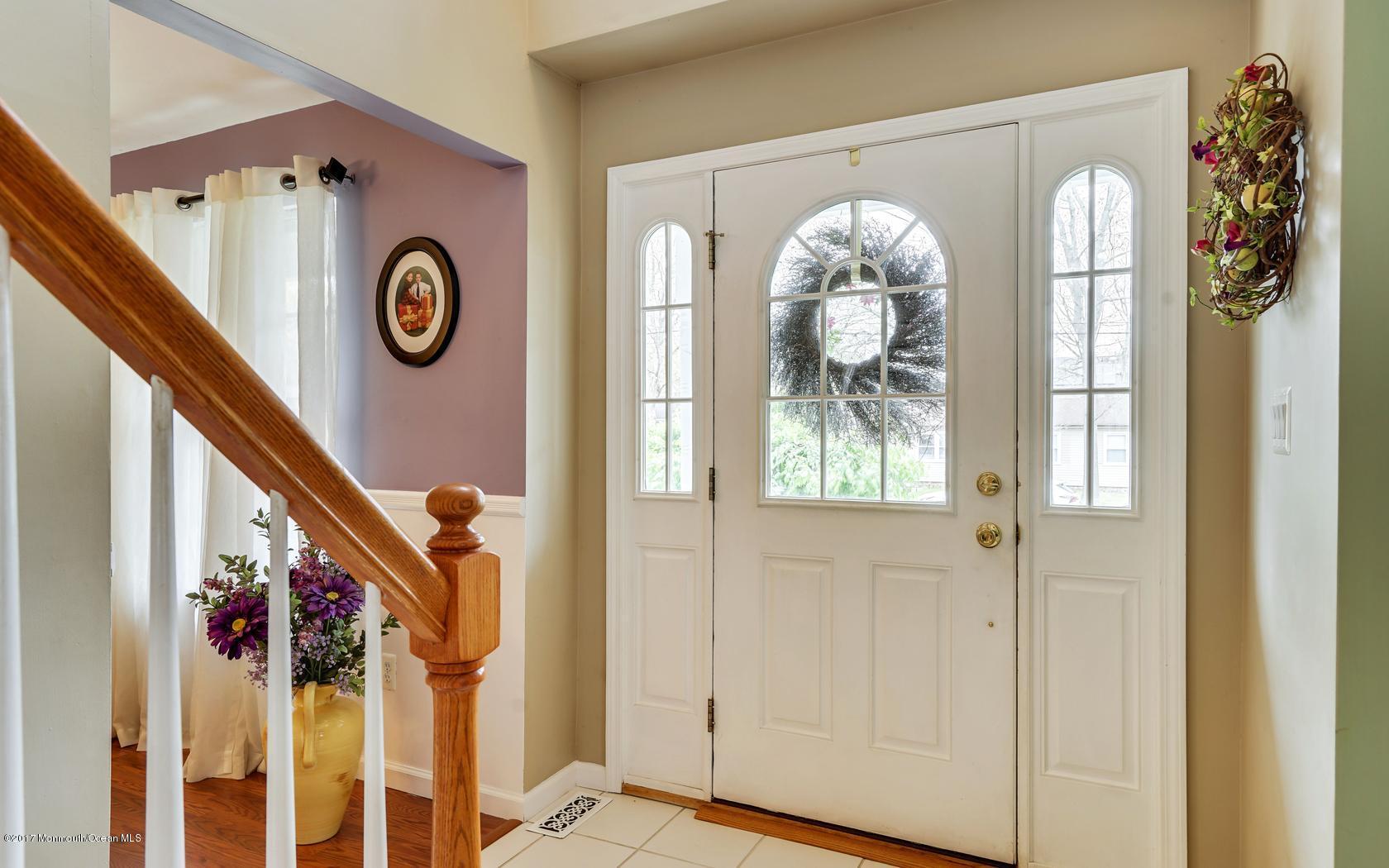 133 Bowsprit Road Manahawkin, NJ 08050 - Photo 22 of 32 a front view of a house with entryway wooden floor and door