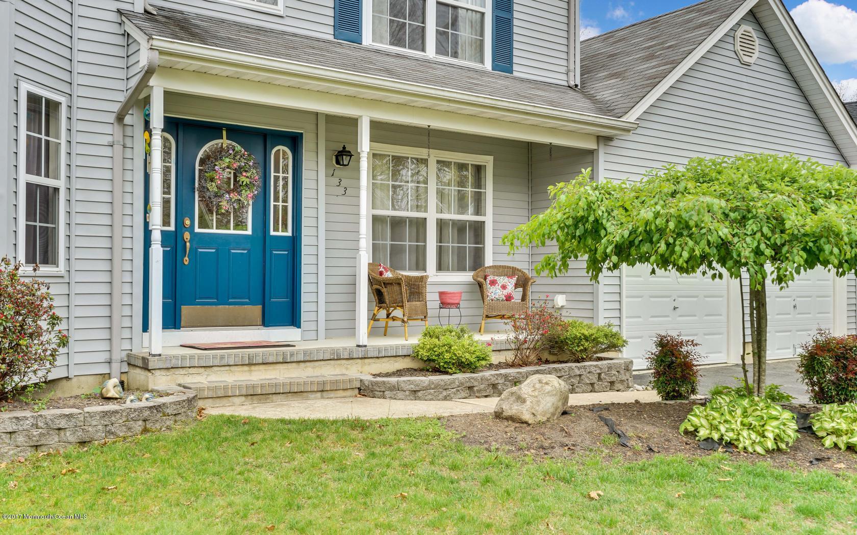 133 Bowsprit Road Manahawkin, NJ 08050 - Photo 3 of 32 a front view of a house with garden