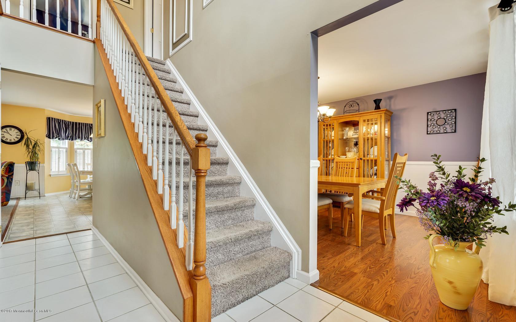133 Bowsprit Road Manahawkin, NJ 08050 - Photo 4 of 32 a view of entryway and hall with wooden floor
