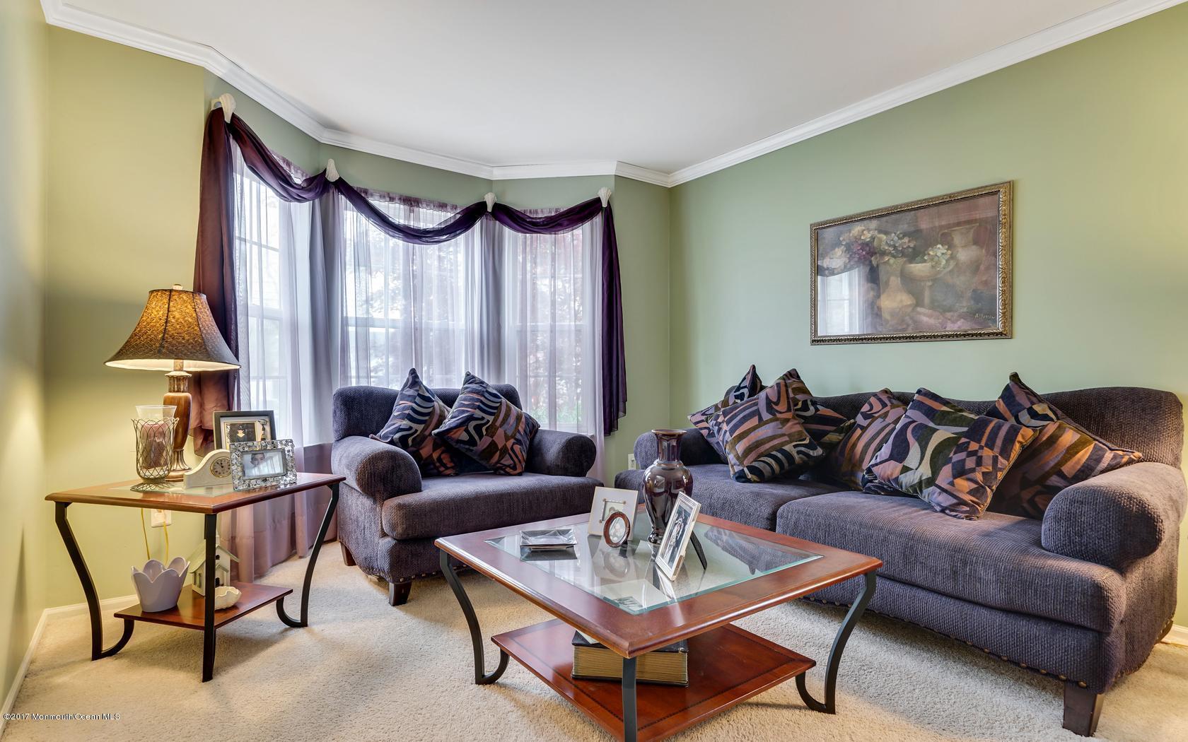 133 Bowsprit Road Manahawkin, NJ 08050 - Photo 5 of 32 a living room with furniture and a lamp