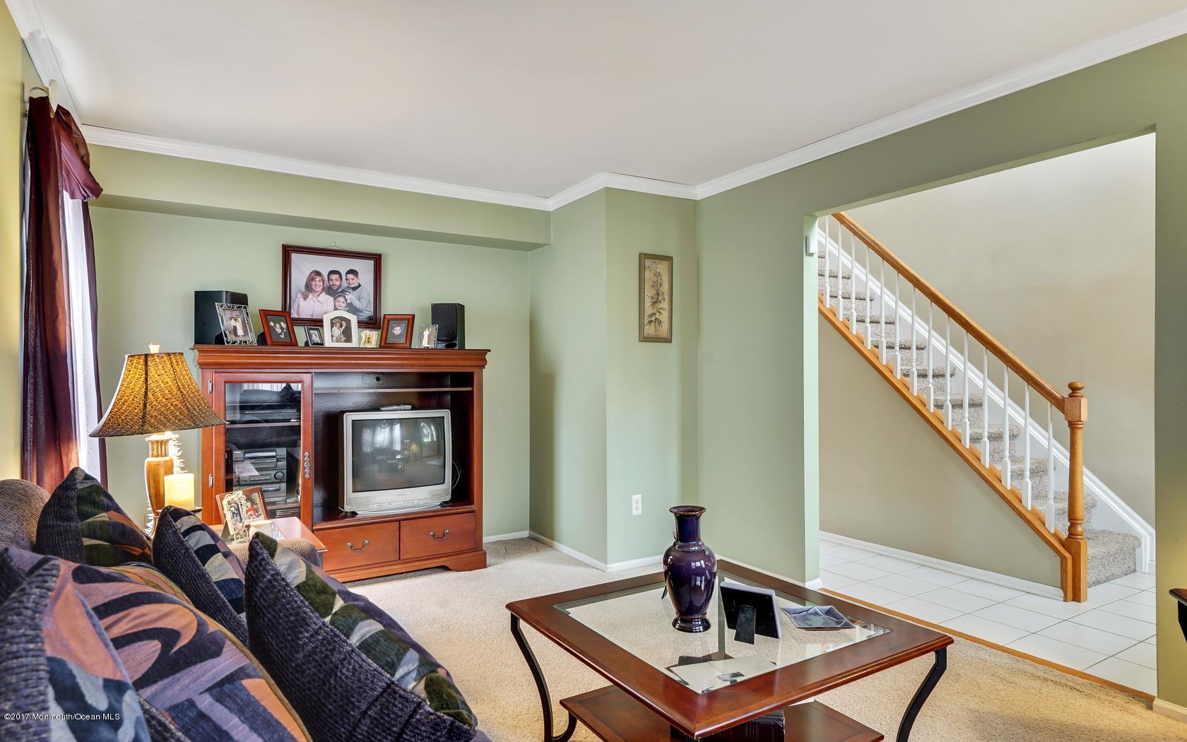 133 Bowsprit Road Manahawkin, NJ 08050 - Photo 6 of 32 a living room with furniture and a fireplace