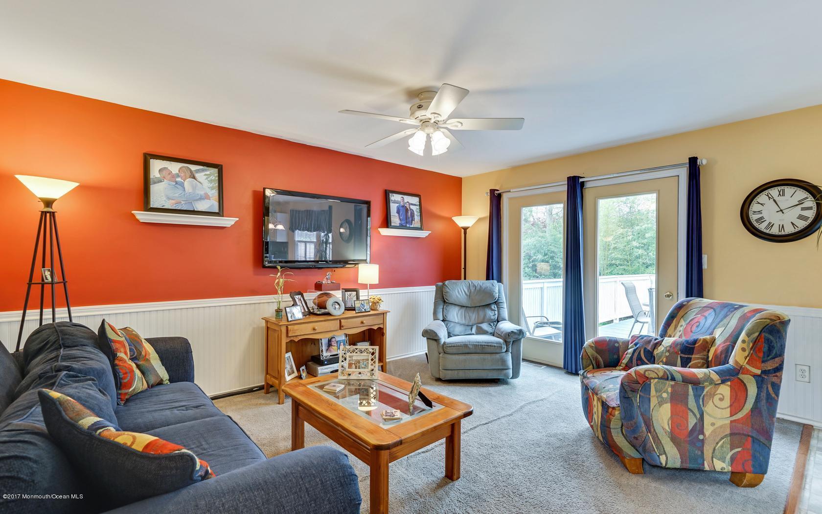 133 Bowsprit Road Manahawkin, NJ 08050 - Photo 9 of 32 a living room with furniture and a large window