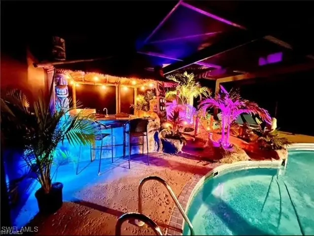 a view of swimming pool with a patio