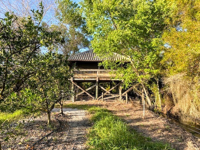 Camelia Street LaBelle, FL 33935 - Photo 2 of 15 a table and chairs with wooden fence