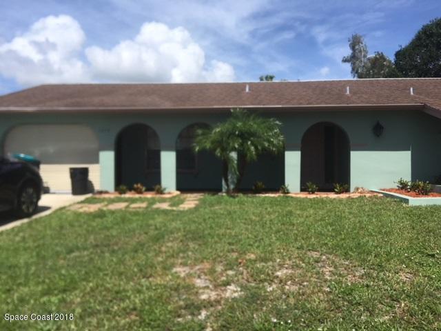 1272 Cromey Road Northeast Palm Bay, FL 32905 - Photo 1 of 53 a view of a yard with yellow space