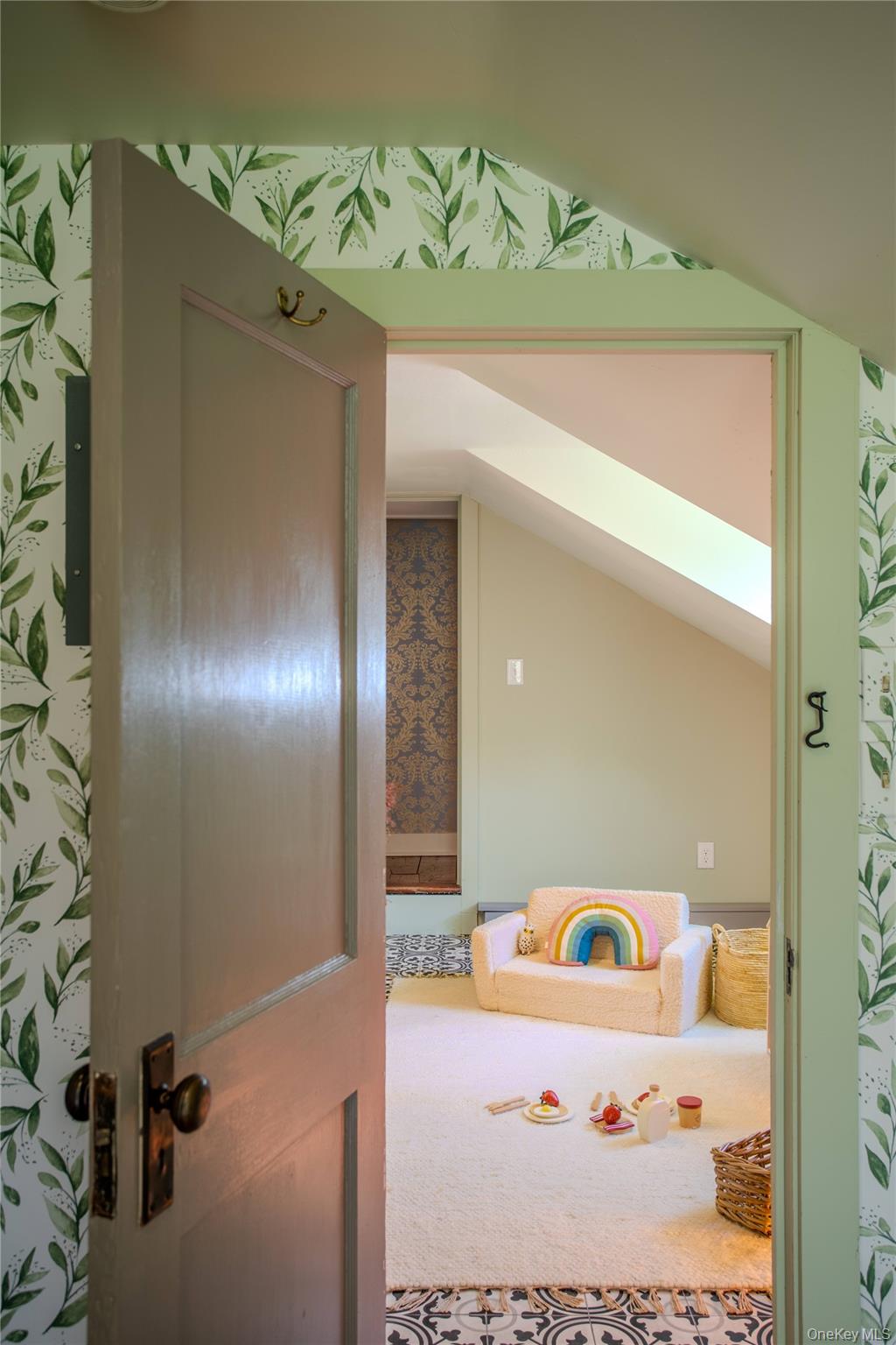 210 Middle Road Hudson, NY 12534 - Photo 38 of 42 Loft space with sloped ceilings, decorative floor tile, patterned accents, and a skylight.