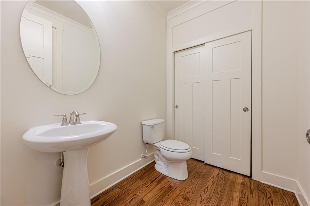 247 Fowler Street Woodstock, GA 30188 - Photo 14 of 72 a bathroom with a sink toilet and a mirror