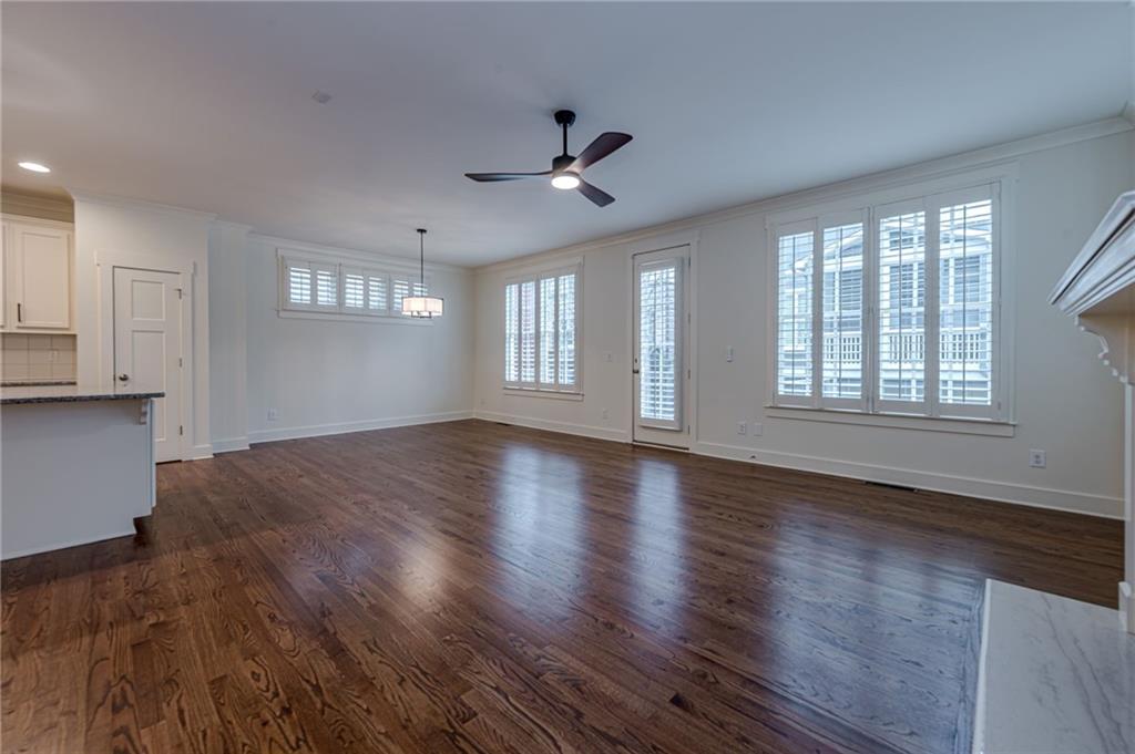 247 Fowler Street Woodstock, GA 30188 - Photo 20 of 72 a view of an empty room with wooden floor and a window
