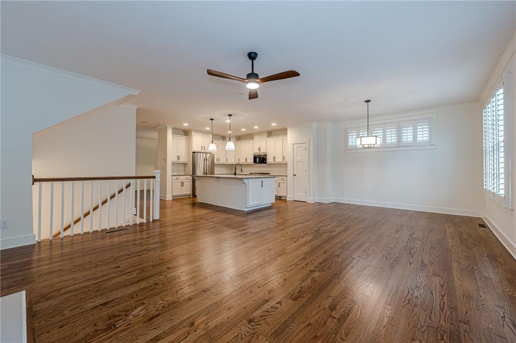 247 Fowler Street Woodstock, GA 30188 - Photo 22 of 72 a view of a kitchen with wooden floor a sink and a window