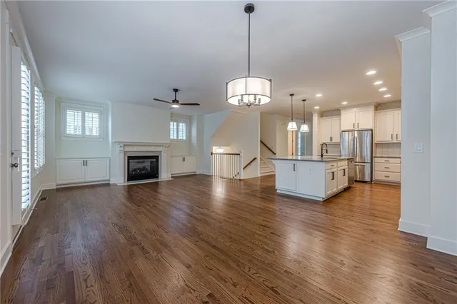 wooden floor in an empty room with a gallery