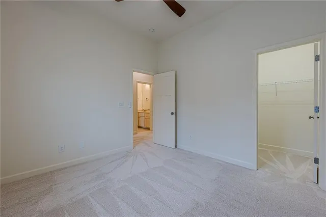 a view of a white building among the street