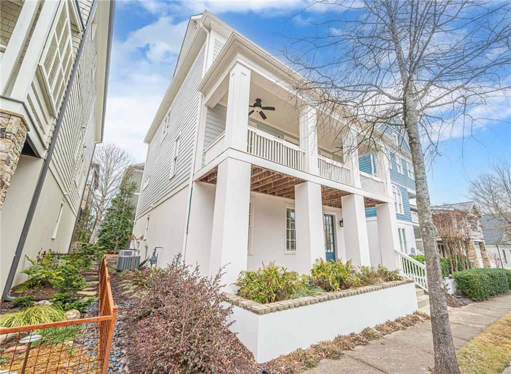 247 Fowler Street Woodstock, GA 30188 - Photo 3 of 72 a front view of a multi story residential apartment building with yard and sign board