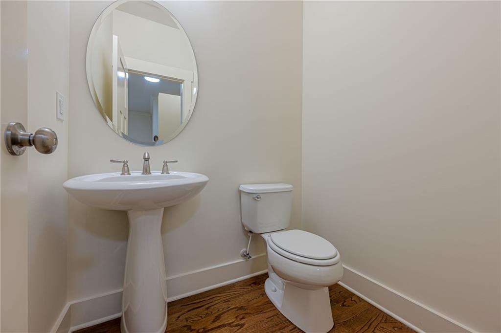 247 Fowler Street Woodstock, GA 30188 - Photo 44 of 72 a bathroom with a sink toilet and a mirror
