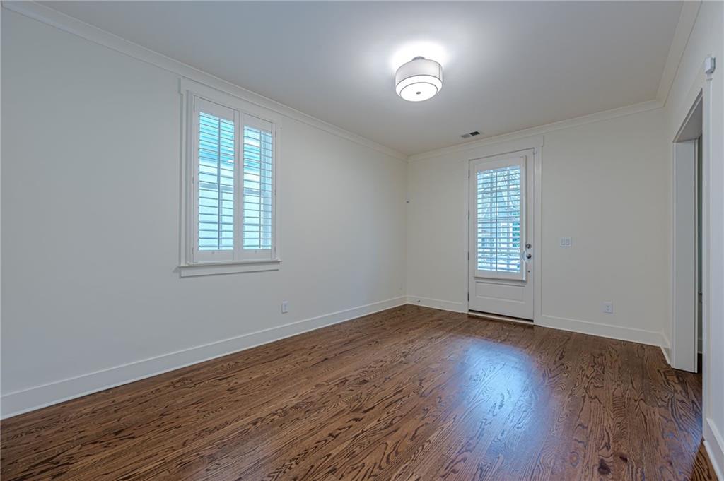 247 Fowler Street Woodstock, GA 30188 - Photo 47 of 72 an empty room with wooden floor and windows