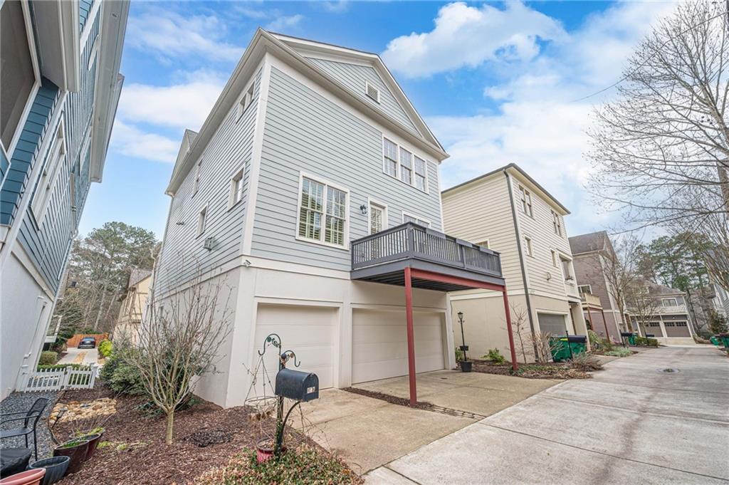 247 Fowler Street Woodstock, GA 30188 - Photo 58 of 72 a view of a white building among the street