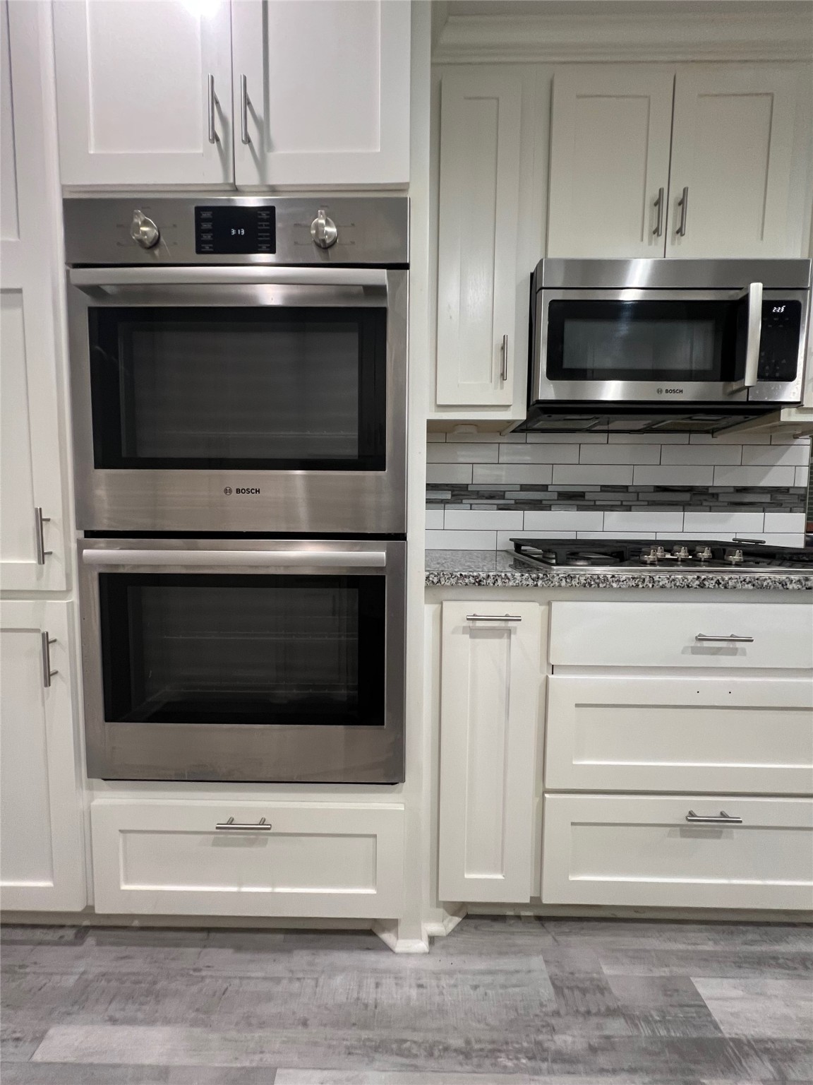2101 Roland Rue Street Pearland, TX 77581 - Photo 5 of 12 a kitchen with stainless steel appliances granite countertop a stove microwave and oven