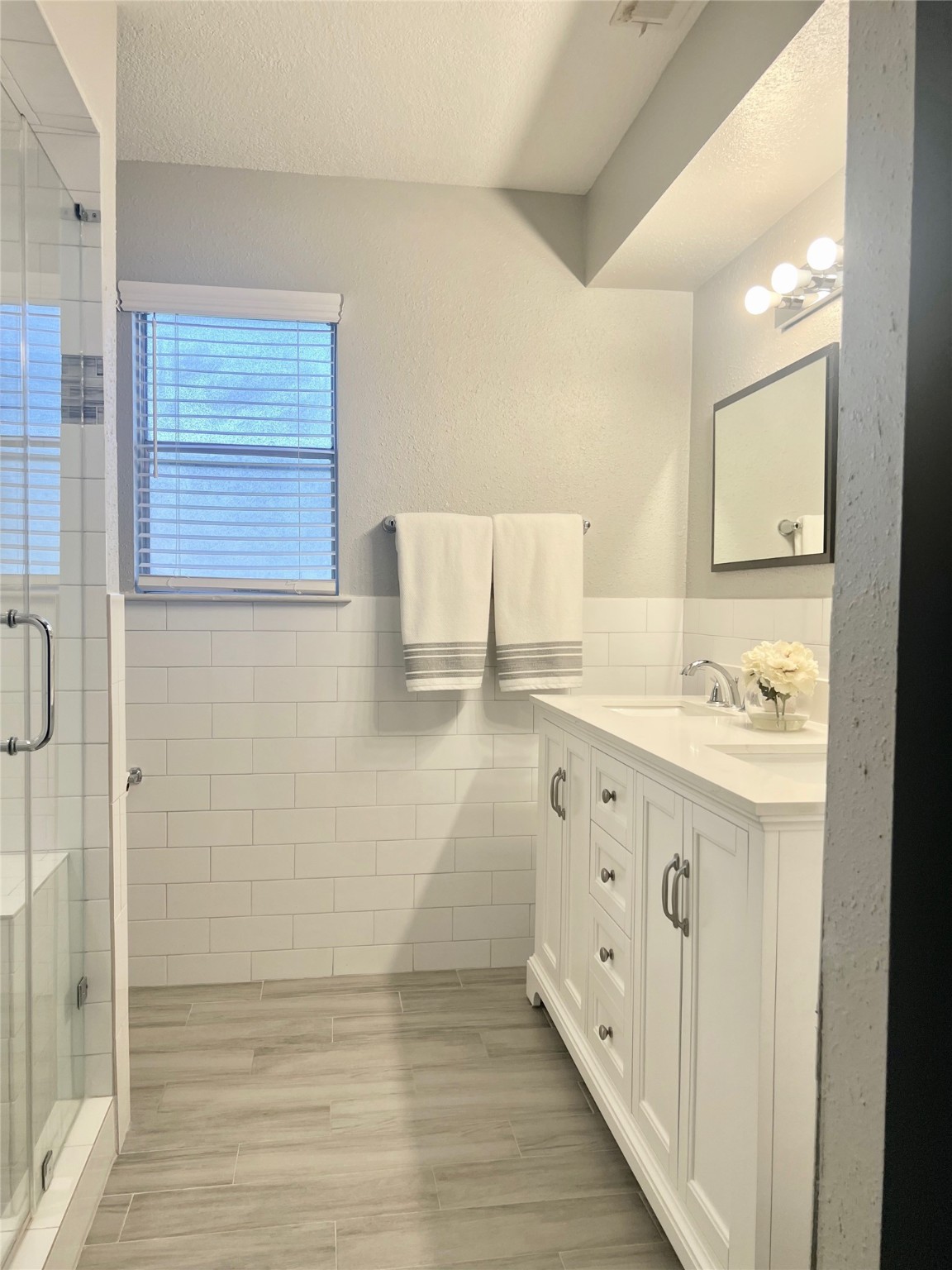 2101 Roland Rue Street Pearland, TX 77581 - Photo 9 of 12 a bathroom with a double vanity sink and mirror