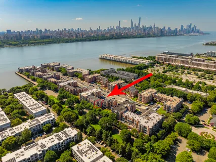 an aerial view of a houses with outdoor space and lake view