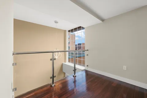 a view of entryway with wooden floor