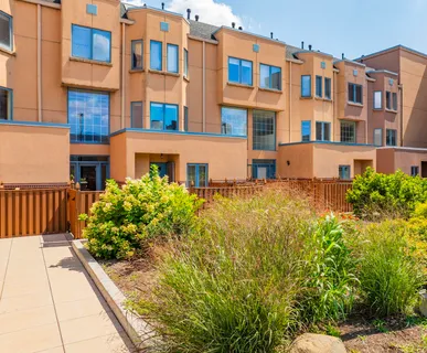 a view of a building next to a yard