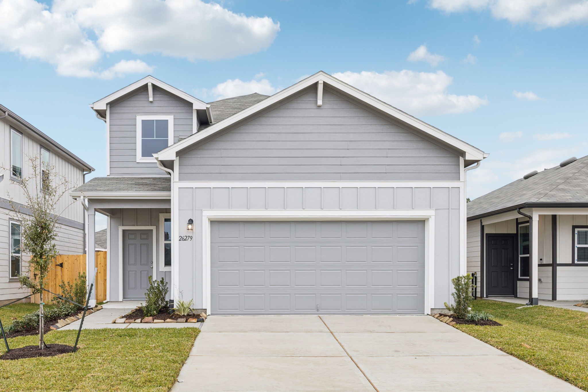 26279 Arrowleaf Drive Magnolia, TX 77355 - Photo 1 of 35 a front view of a house with garden