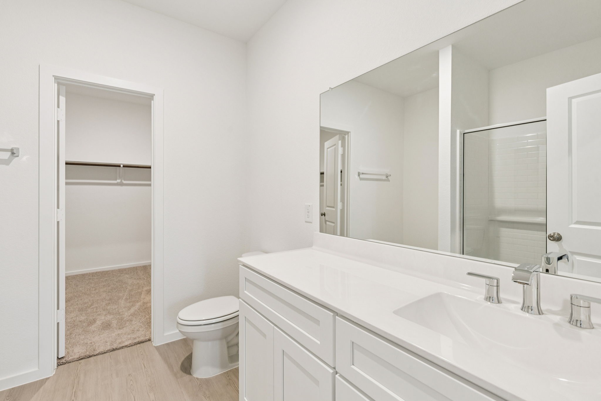 26279 Arrowleaf Drive Magnolia, TX 77355 - Photo 20 of 35 a bathroom with a sink a toilet and a mirror
